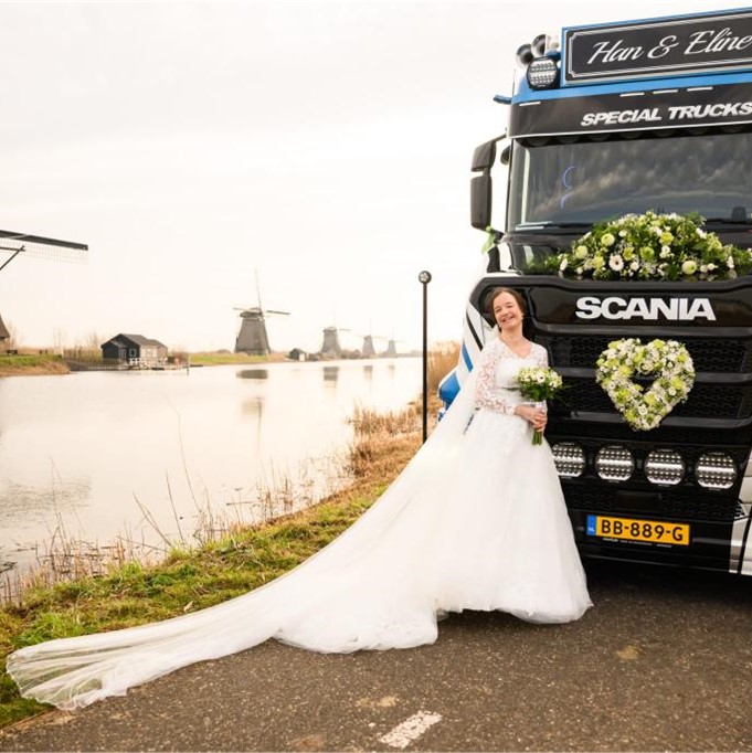Bride with truck near windmills.