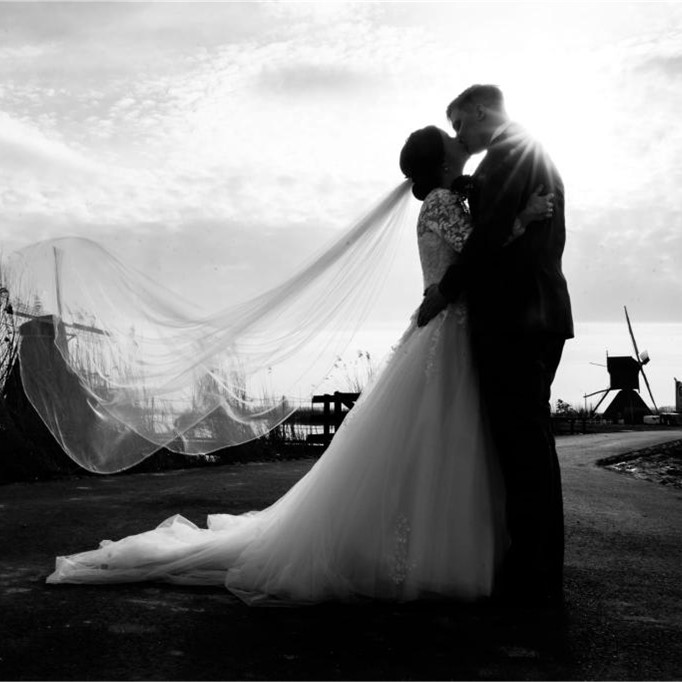Silhouette of couple sharing kiss