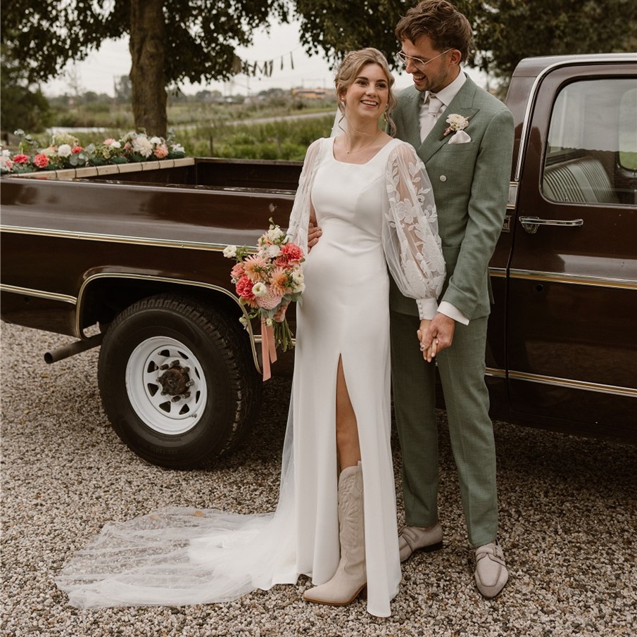 Bride and groom by vintage truck
